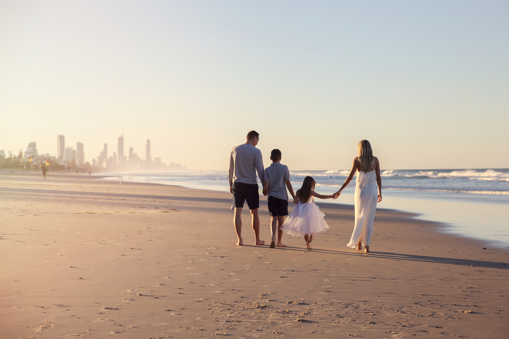 Family of four portrait on the beach, toning soft focus