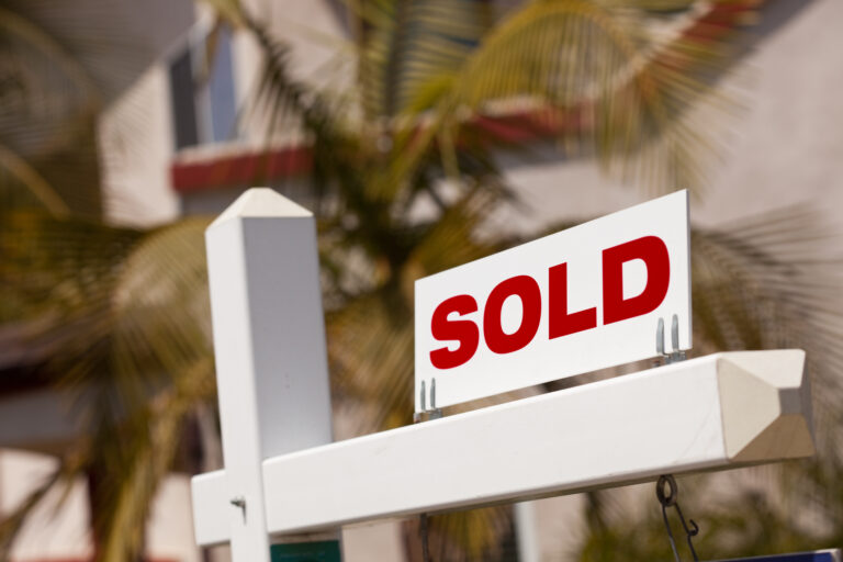 Close-up of a sold real estate sign