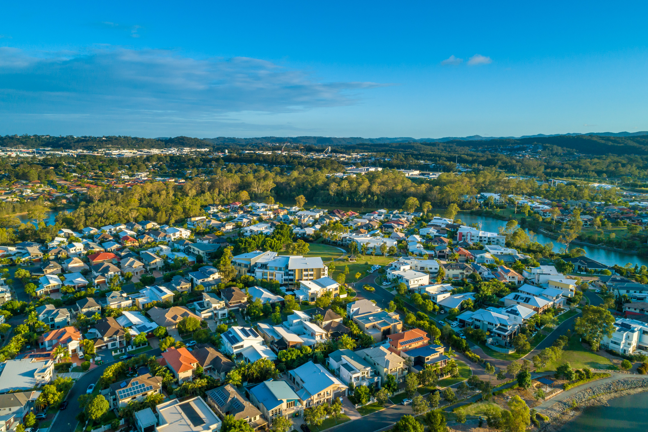 Aerial view of Varsity Lakes suburb at sunset. Gold Coast, Queensland, Australia