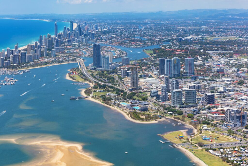 "Panoramic view of Surfers Paradise Beach during a summer day with golden sand and calm ocean" 